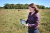 Mississippi State University professor of animal and dairy sciences and Extension beef cattle specialist Jane Parish uses an application on an iPad to review cattle break-even prices while in the field at the Henry H. Leveck Research Farm on the south side of the MSU campus in December 2013. (File Photo by MSU Ag Communications/Scott Corey)