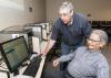 As part of an ongoing program of computer skills workshops, John Giesemann with the Mississippi State University Extension Service Center for Technology Outreach shows Vern Boothe how to access a slideshow program at the WIN Job Center in Madison on July 9, 2013. (File photo by MSU Ag Communications/Scott Corey)