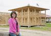 Jo Lynn Mitchell stops near the construction of Tiny Town, an addition to the agritourism venture at Mitchell Farms in Collins, Miss., on April 17, 2014. (Photo by MSU Ag Communications/Kat Lawrence)