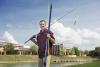 Mississippi State University senior Charles Parker recently won $10,000 during MSU's Office of Entrepreneurship and Technology Transfer Entrepreneurship Week for his fishing pole protectors, called Rod Sox. Parker is shown here at MSU's Chadwick Lake on May 13, 2014. (Photo by MSU Office of Public Affairs/Megan Bean)