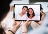 Young couple using digital tablet together