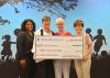 Representatives of the Early Years Network and UnitedHealthcare take part in a check presentation ceremony during the grand opening of the Hinds County Resource and Referral Center at 350 West Woodrow Wilson Avenue in Jackson, Mississippi on June 25, 2015. Celebrating their newly formed partnership are Kenisha Potter, left, pediatric health care coordinator for UnitedHealthcare; Louise E. Davis, professor with the Mississippi State University Extension Service and director of the Early Years Network; Connie