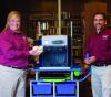 Christy King, Clarke County Extension agent, and Roberto Gallardo, an associate Extension professor in the Center for Technology Outreach, display items made with a new 3-D printer at the Quitman Public Library. (Photo by MSU Extension Service/Kevin Hudson)