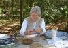 Judy Breland, Mississippi State University Extension Service agent in Stone County, demonstrates pine needle basket weaving at the 2015 Piney Woods Heritage Festival at the MSU Crosby Arboretum in Picayune, Mississippi. The 2016 festival is set for Nov. 18 and 19. (Photo by Mississippi State University Extension Service/Pat Drackett)