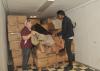 La-Z-Boy Inc. has donated about 130 boxes of discarded upholstery fabric to the Mississippi State University Extension Service. Sylvia Clark, left, an Extension family and consumer sciences associate, and student worker Kamau Bostic unpack the truckload of material March 24, 2017. (Photo by MSU Extension/Kat Lawrence)